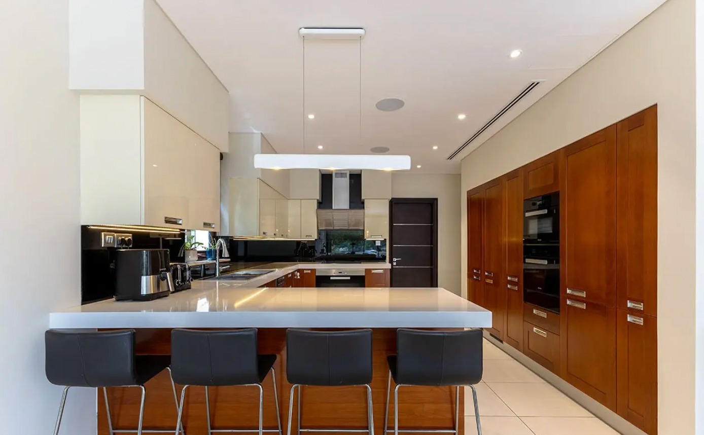 Renovated villa in Sanctuary Falls, Jumeirah Golf Estates — pool terrace with golf course views